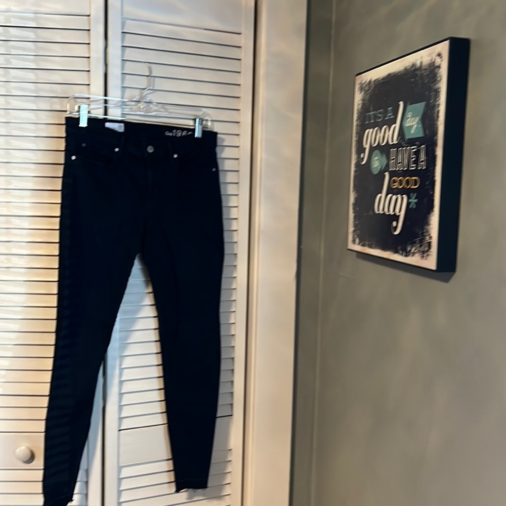 Dark wash skinny jeans with unfinished hem